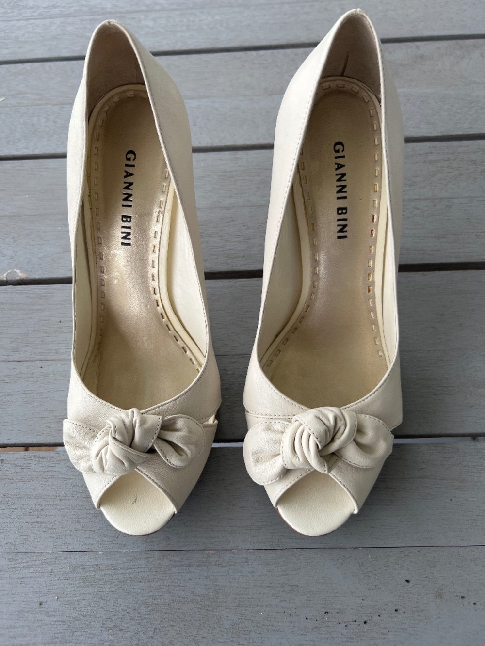 Peep toe with a bow ,cream colored 3 1/2 inch high heel pump